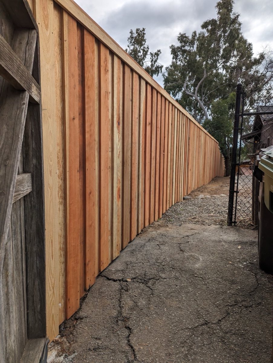 Side-yard wood fence after pressure wash