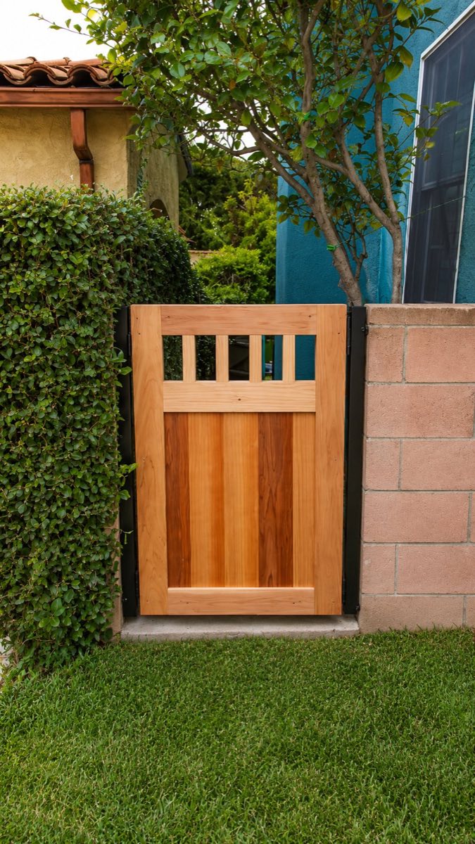 Refinished wood gate with iron hardware