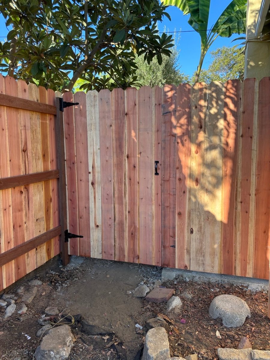 Residential wood fence after pressure wash